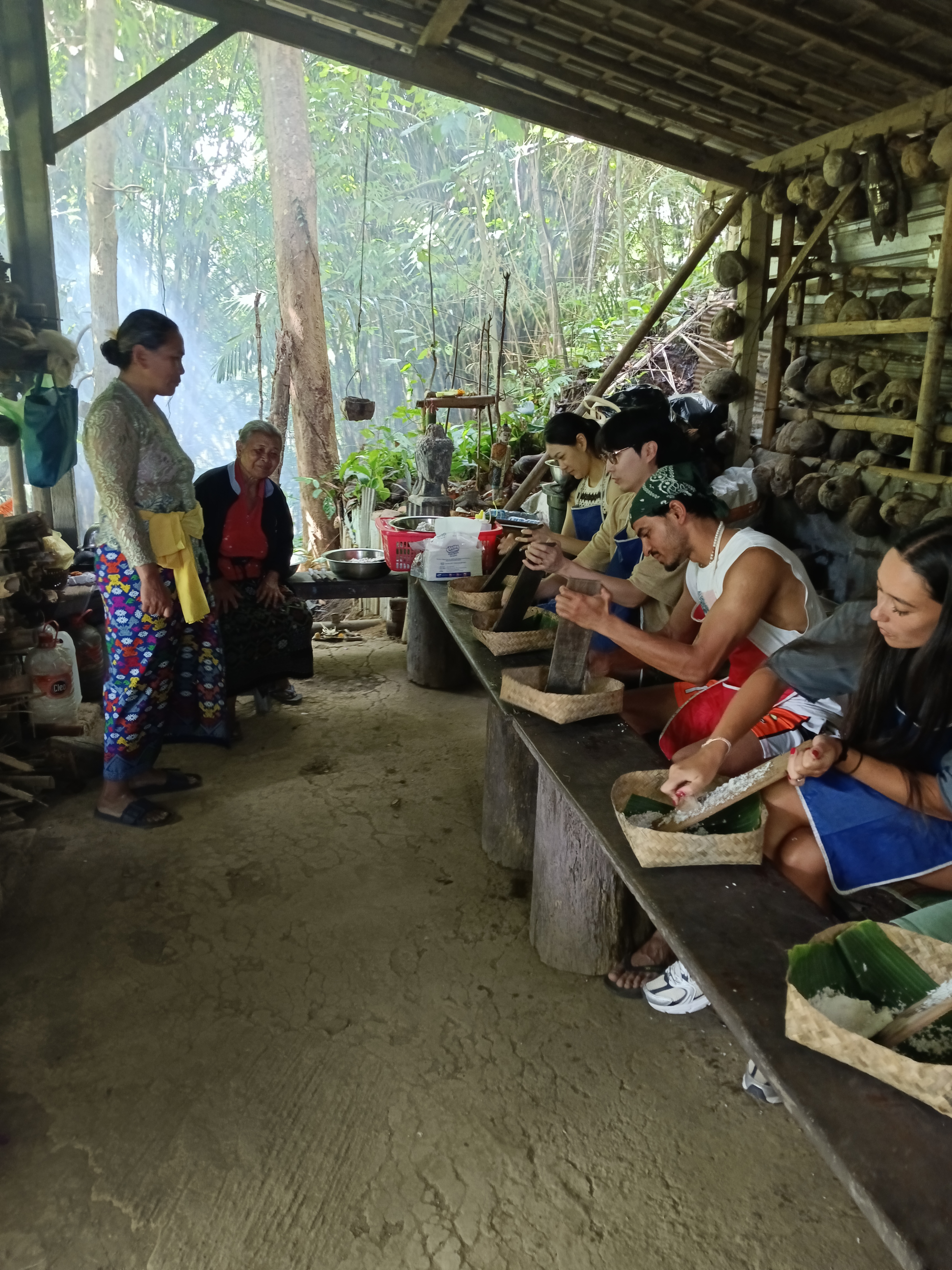Bali Cebelok Gesiuh family sharing traditional coconut oil making